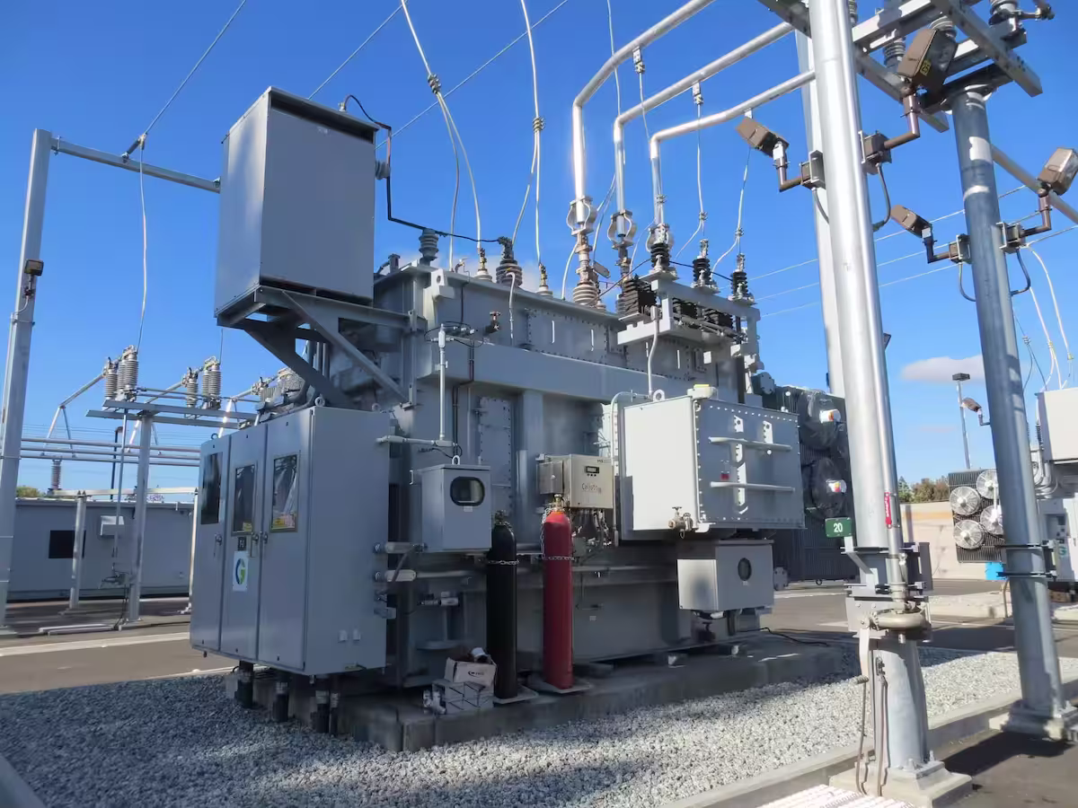 Substation power transformer with high voltage bushings and cooling radiators